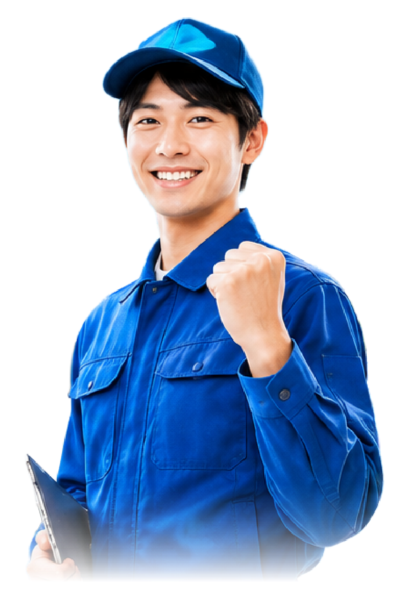 笑顔でガッツポーズをする作業服の男性スタッフの画像